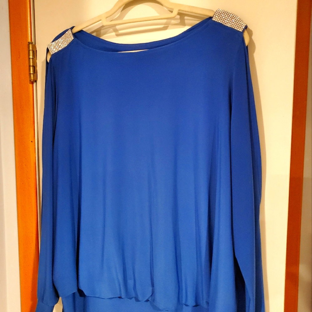 Cold Shoulder tunic with rhinestone epaulets.
